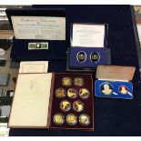 A collection of cased silver medals, each with hand-enamelled decoration by Carpenter & Howlett,