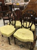 A set of ten early 19th Century mahogany shield back dining chairs in the Hepplewhite taste with