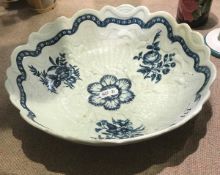 An 18th Century Worcester shaped circular junket dish moulded in relief with foliage and basket