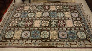 A Persian style rug, the central panel s