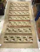 A needlework rug of striped pattern with