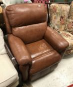 A modern brown leather reclining armchai