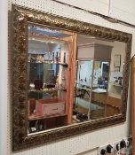 A modern rectangular wall mirror with fo