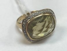 A nine carat gold citrine and diamond se