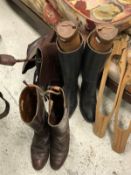 A pair of brown leather hunting boots