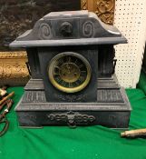 A Victorian black marble cased mantle cl