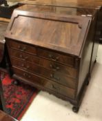 A mahogany bureau in the Georgian style