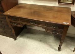 A Victorian mahogany writing table, the