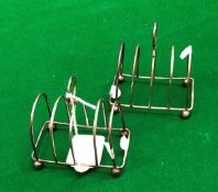 A pair of four section silver toast rack