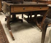 A modern mahogany sofa table