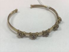 A nine carat gold and pink and white stone set bangle in the Victorian taste