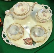 A Limoges rose and gilt decorated tête-à