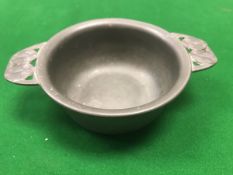 An Art Nouveau style pewter quaich by Liberty & Co No'd 01285 to base designed by Archibald Knox