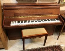 A modern mahogany cased upright piano the iron framed overstrung movement by Bentley of Stroud