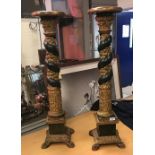 A pair of carved giltwood and gesso and verdigris patinated altar sticks in the Renaissance manner,