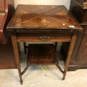 An Edwardian rosewood and marquetry inlaid envelope card table with single frieze drawer on square