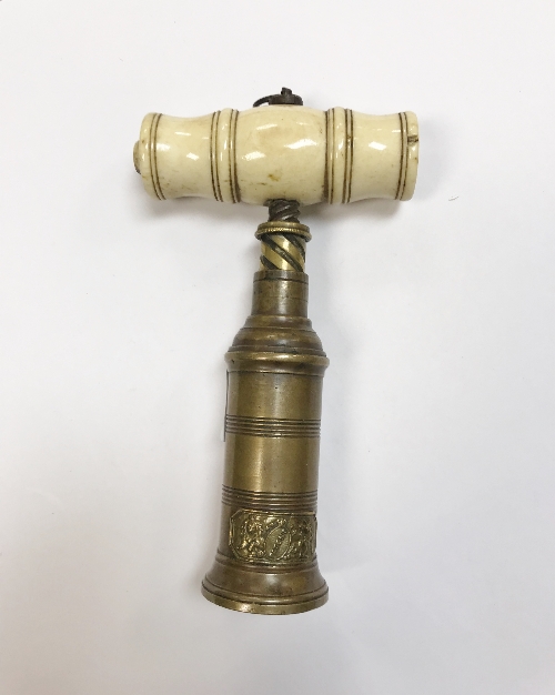 An early 19th Century brass king screw with double action and turned bone handle,