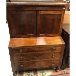 A 19th Century American mahogany bureau bookcase with secret compartment over the canted recess and