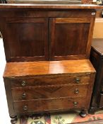 A 19th Century American mahogany bureau bookcase with secret compartment over the canted recess and