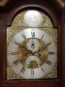 An 18th Century long case clock the eight day movement with brass arch dial and silver chapter ring