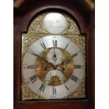 An 18th Century long case clock the eight day movement with brass arch dial and silver chapter ring