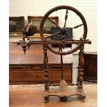 A 19th Century Continental fruitwood spinning wheel of typical form,