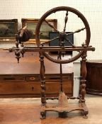 A 19th Century Continental fruitwood spinning wheel of typical form,