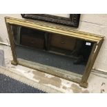 A gilt framed overmantel mirror