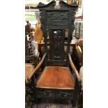 A Victorian carved oak framed hall chair in the 17th Century manner bearing plaque inscribed
