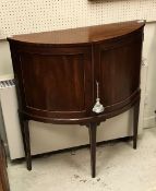 A 19th Century mahogany and satinwood strung two door side cabinet in the demilune form raised on