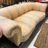 A Victorian Howard & Sons serpentine fronted sofa,
