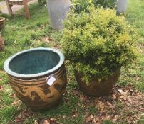 Two large patinated garden pots