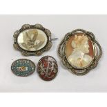 A collection of four brooches to include a Victorian mourning brooch with hair set to the interior,