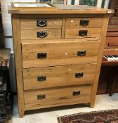 A modern oak chest of two short over three long drawers and matching two drawer filing chest