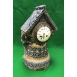 A Martin Brothers stoneware mantel clock by Robert Wallace Martin,