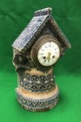 A Martin Brothers stoneware mantel clock by Robert Wallace Martin,