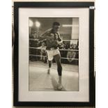 A photographic print of Muhammed Ali sparring