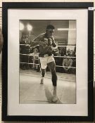 A photographic print of Muhammed Ali sparring