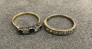 A white gold mounted half eternity ring together with a five stone sapphire and diamond ring