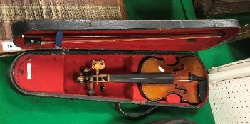 An early 20th Century child's violin in case,