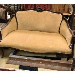 An Edwardian mahogany framed salon settee on cabriole front legs to castors,