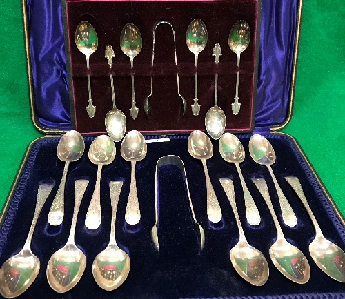 A cased set of twelve late Victorian silver teaspoons and matching sugar tongs (Sheffield 1900)