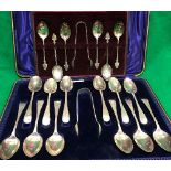 A cased set of twelve late Victorian silver teaspoons and matching sugar tongs (Sheffield 1900)