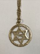 A 9 carat gold Star of David pendant with a 9 carat gold chain