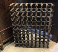 A wooden and metal 80 bottle wine rack