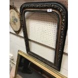 A 19th Century French ebonised arched mirror with floral decoration