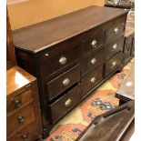 A 19th Century North Country English oak and crossbanded mule chest the top rising over three dummy