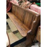 A late Victorian pitch pine chapel pew with end brass stick rail