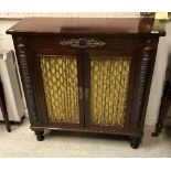 An early 19th Century mahogany and rosewood crossbanded chiffonier the plain top above two lattice