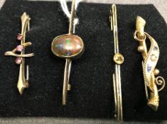 Four 9 carat gold bar brooches to include a black opal